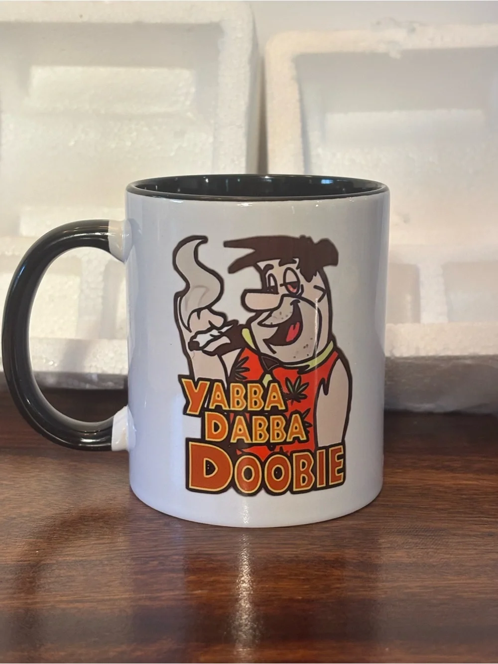 Novelty White Ceramic Coffee Mug with Black Handle - Yabba Dabba Doobie Design